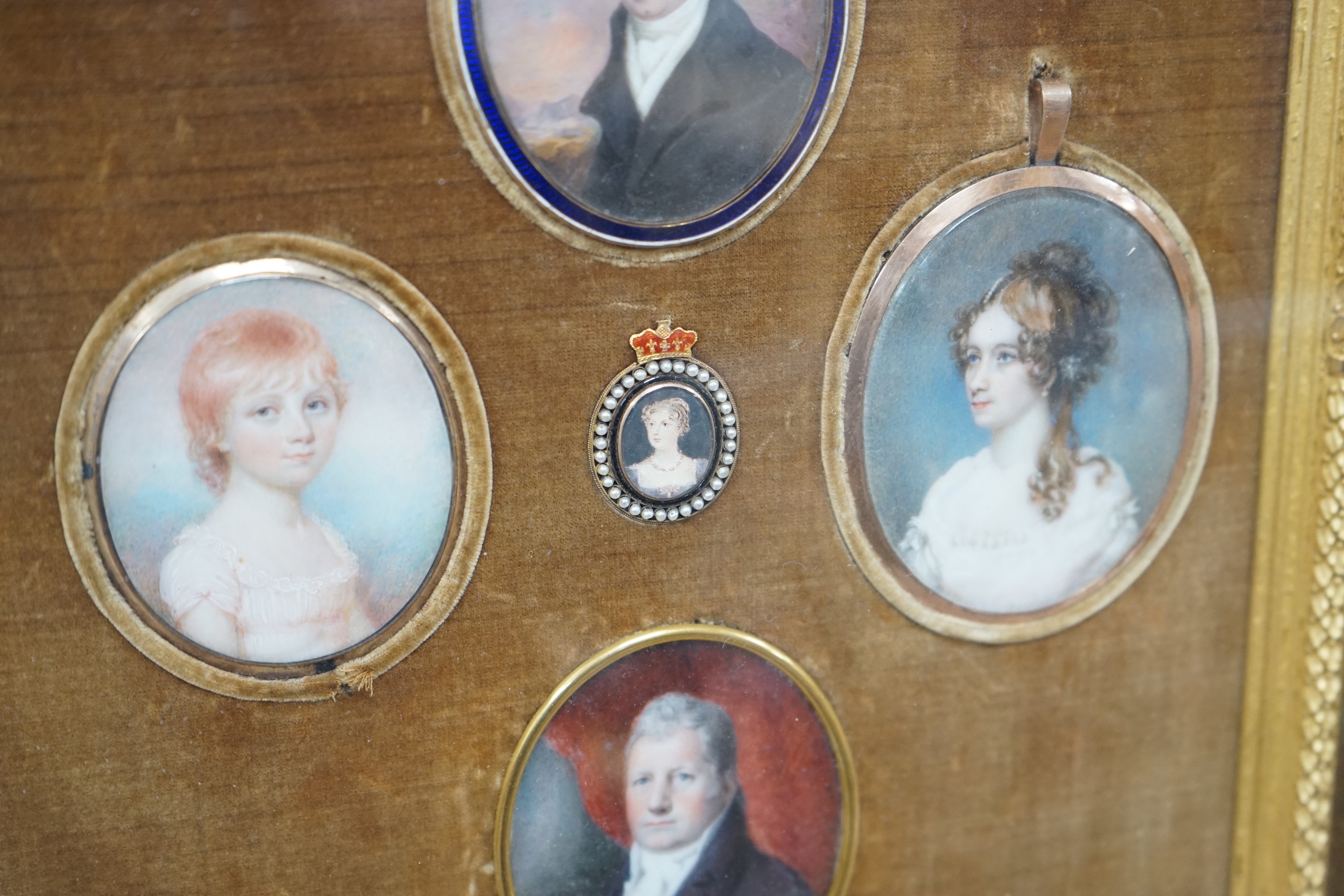 A group of five 19th century portrait miniatures on ivory, framed as one, in a decorative gilt and velvet mount rosewood frame. Overall 36 x 32cm